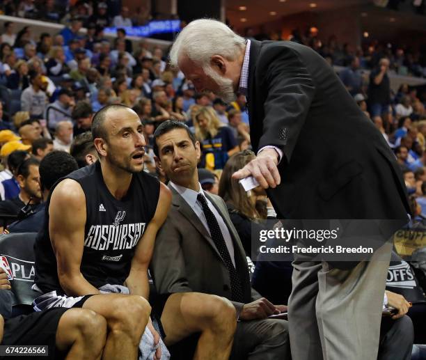 Head coach Gregg Popovich of the San Antonio Spurs coaches Manu Ginobili during the second half of a 103-96 Spurs victory over the Memphis Grizzlies...