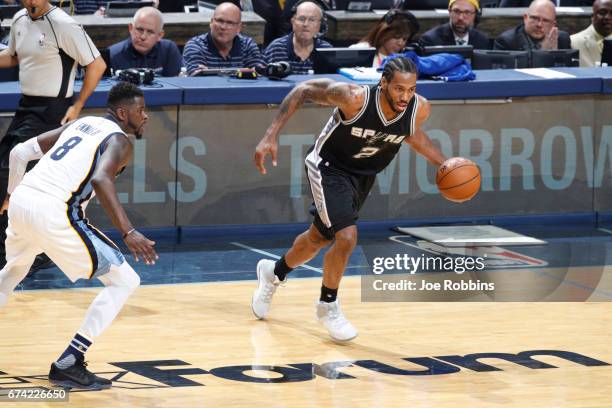 Kawhi Leonard of the San Antonio Spurs handles the ball against the Memphis Grizzlies during Game Six of the Western Conference Quarterfinals of the...