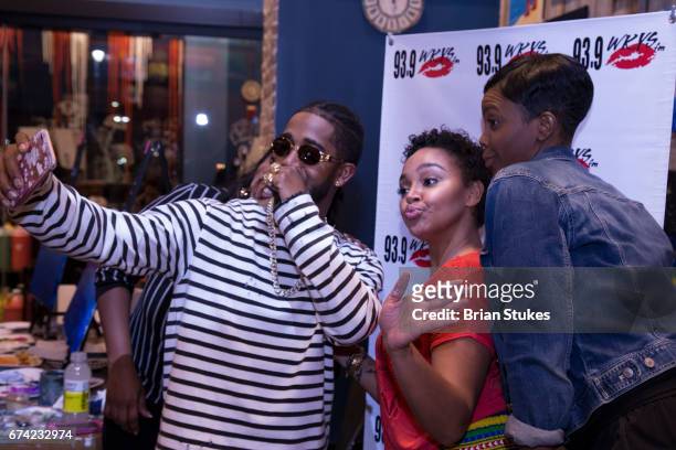 Oxon Hill, Maryland. Omarion takes selfie with 93.9 WKYS Staff Danni Starr and Janine Brunson during Sip & Paint at Muse Paintbar on April 27, 2017...