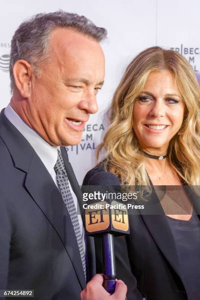 Rita Wilson and Tom Hanks speak to the media as they arrive to attend the world premiere of 'The Circle' at the 2017 Tribeca Film Festival in New...