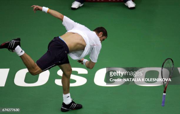 Russian Marat Safin reacts, throwing a rocket during the final match of Kremlin Cup tennis tournament in Moscow, 15 October 2006 against his...