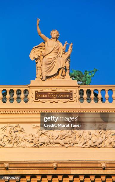 statue of apollo on burgtheater - burgtheater wien stock pictures, royalty-free photos & images