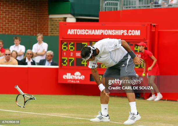 Chilean tennis player Fernando Gonzales throws his raquet in anger during his match against Russian tennis player, Dmitry Tursunov, during The...