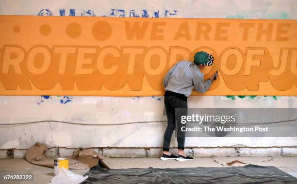 Rose Jaffe prepares a banner in the Uptown Art House a "pop-up" art space created for participants in the Peoples Climate March in Washington, DC on...