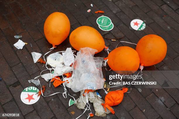 Picture taken in Amsterdam, on April 28 2017, shows garbage a day after Kings Day was celebrated. / AFP PHOTO / ANP / Bas Czerwinski / Netherlands OUT