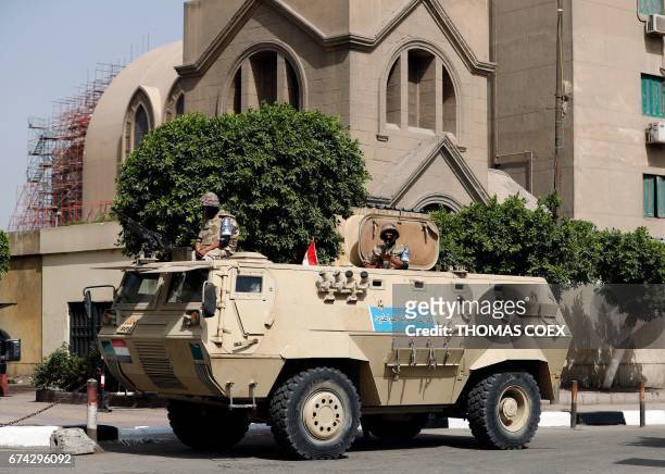 An Egyptian army vehicle stands guard outside Saint Mark's Coptic Orthodox Cathedral in central Cairo, a few hours before Pope Francis' visit...