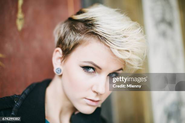 blonde punk style freaky young woman portrait - woman short hair serious stock pictures, royalty-free photos & images