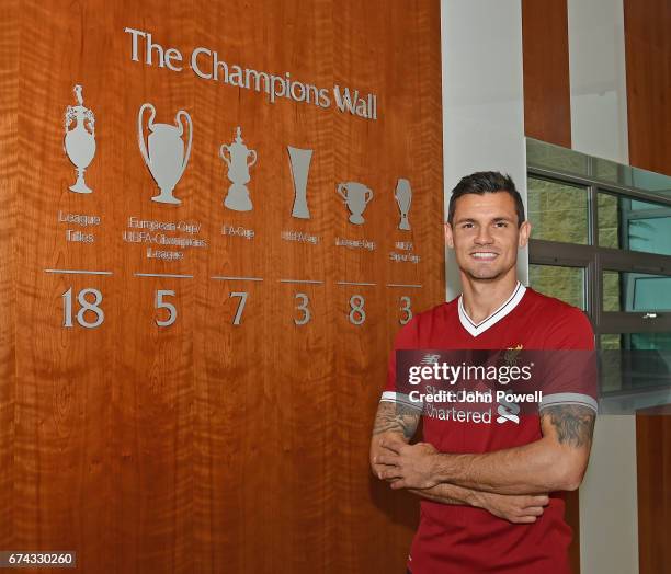 Dejan Lovren poses as he signs a new four-year contract with Liverpool FC at Melwood Training Ground on April 27, 2017 in Liverpool, England.