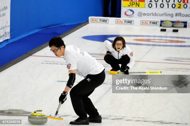 Ayumi Ogasawara and Shinya Abe of Japan comepte in the Group A match between Japan and Finland during day six of the World Mixed Doubles Curling...