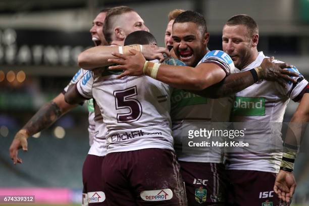Curtis Sironen, Jackson Hastings, Akuila Uate Daly Cherry-Evans, Dylan Walker and Blake Green of the Sea Eagles celebrate Uate scoring a try during...