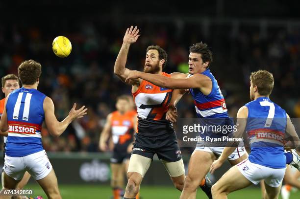 Shane Mumford of the Giants competes in the ruck against Tom Boyd of the Bulldogs during the round six AFL match between the Greater Western Sydney...