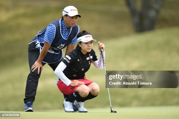 Pei-Ying Tsai of Taiwan lines up her putt on the 1st hole during the first round of the CyberAgent Ladies Golf Tournament at the Grand Fields Country...