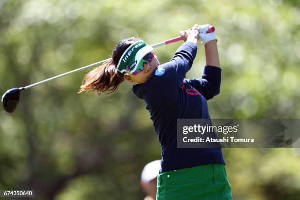 Chie Arimura of Japan hits her tee shot on the 13th hole during the first round of the CyberAgent Ladies Golf Tournament at the Grand Fields Country...