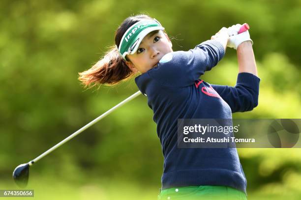 Chie Arimura of Japan hits her tee shot on the 2nd hole during the first round of the CyberAgent Ladies Golf Tournament at the Grand Fields Country...