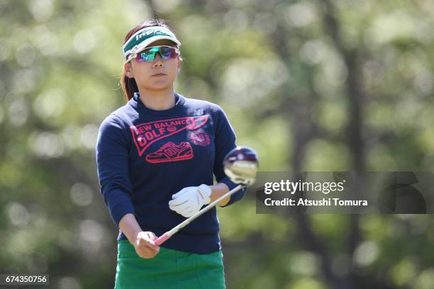 Chie Arimura of Japan hits her tee shot on the 13th hole during the first round of the CyberAgent Ladies Golf Tournament at the Grand Fields Country...