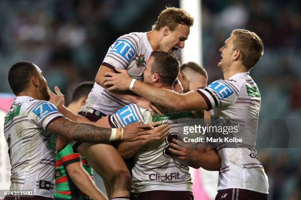 Dylan Walker, Daly Cherry-Evans, Blake Green and Tom Trbojevic of the Sea Eagles celebrate Blake Green scoring a try during the round nine NRL match...