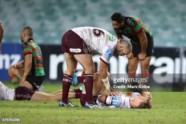 Nate Myles of the Sea Eagles checks on Daly Cherry-Evans of the Sea Eagles after a hit from Sam Burgess of the Rabbitohs during the round nine NRL...