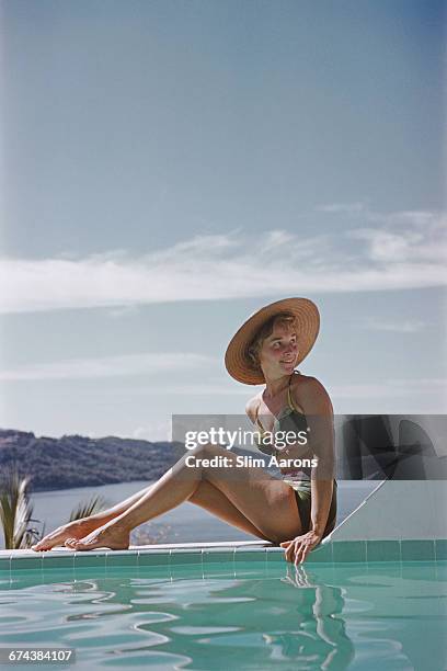 Ingrid Morath sunbathes by a swimming pool next to the sea in Acapulco, January 1961. Ingrid was born in Rio de Janeiro and lives in Mexico City.