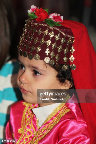 Turkish girl dressed in traditional attire during Nevruz celebrations in Toronto, Canada. Nevruz which means 'new day' marks the first day of Spring,...