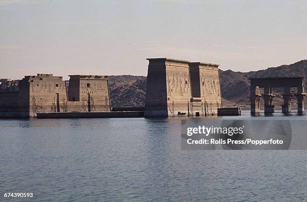 View of the temple complex of Philae, located on the island of Philae in the River Nile in Egypt and flooded by construction of the Aswan Low Dam....