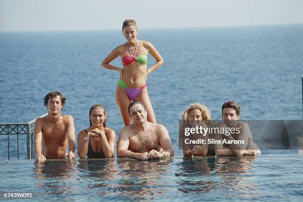 Marie Chantal Miller , future wife of Prince Pavlos of Greece, lounging with friends at the pool of the Hotel Bel-Air, Cap Ferrat, 1991.