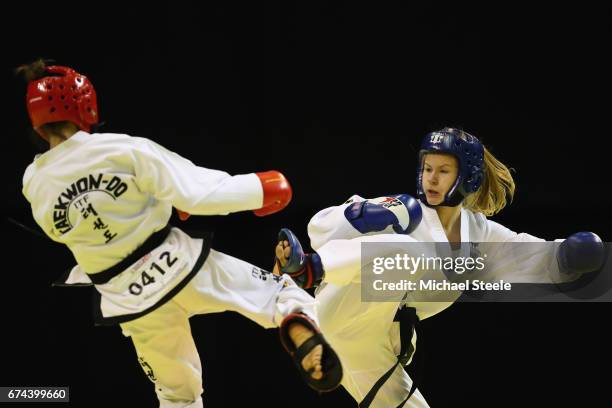 Anette Russ of Estonia competes with Vitaliya Gagloeva of Russia in the Individual Sparring Junior 14-15 Female 52 kg category during day two of the...