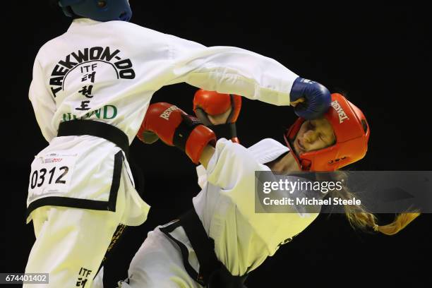 Anna Skuratova of Ukraine receives a blow from Sofia Hu of Ireland in the Individual Sparring Junior 14-15 Female 52 kg category during day two of...