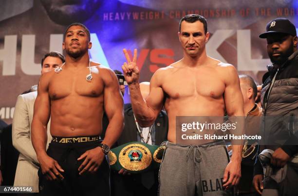 Anthony Joshua and Wladimir Klitschko pose during the weigh-in prior to the Heavyweight Championship contest at Wembley Arena on April 28, 2017 in...