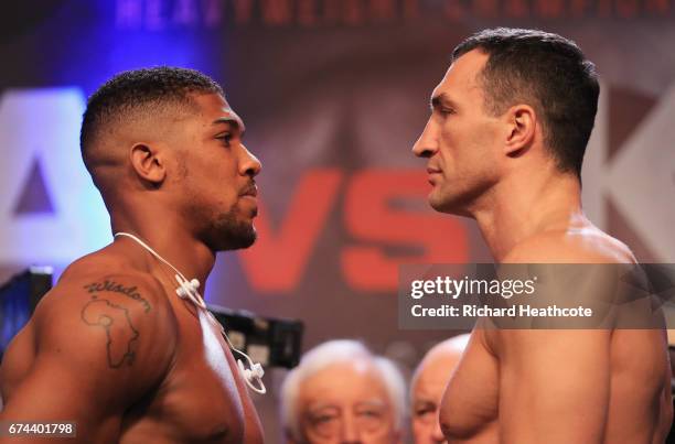 Anthony Joshua and Wladimir Klitschko face each other during the weigh-in prior to the Heavyweight Championship contest at Wembley Arena on April 28,...