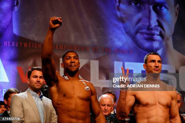 British boxer Anthony Joshua and Ukrainian boxer Wladimir Klitschko pose during the weigh-in ahead of their world heavyweight title unification bout...
