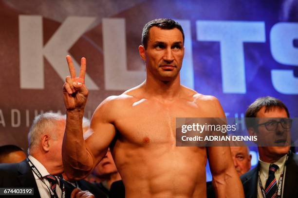 Ukrainian boxer Wladimir Klitschko poses during the weigh-in ahead of his world heavyweight title unification bout against British boxer Anthony...