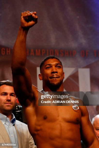 British boxer Anthony Joshua poses during the weigh-in ahead of his world heavyweight title unification bout against Ukrainian boxer Wladimir...