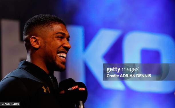 British boxer Anthony Joshua speaks during the weigh-in ahead of his world heavyweight title unification bout against Ukrainian boxer Wladimir...