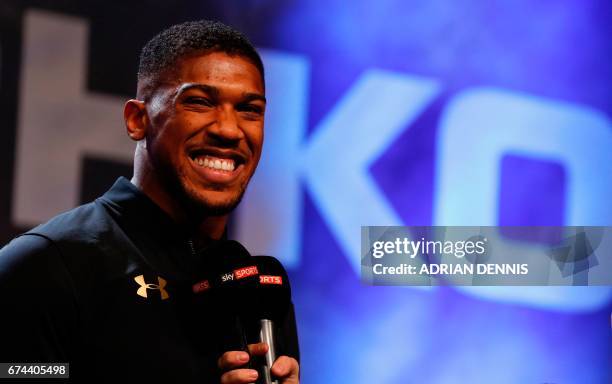 British boxer Anthony Joshua speaks during the weigh-in ahead of his world heavyweight title unification bout against Ukrainian boxer Wladimir...