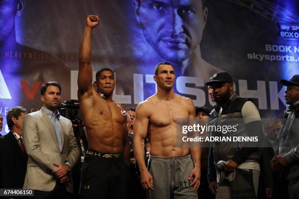 British boxer Anthony Joshua and Ukrainian boxer Wladimir Klitschko pose together during the weigh-in event at Wembley in London on April 28, 2017...