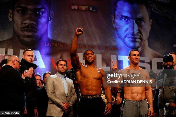 British boxer Anthony Joshua and Ukrainian boxer Wladimir Klitschko pose together during the weigh-in event at Wembley in London on April 28, 2017...