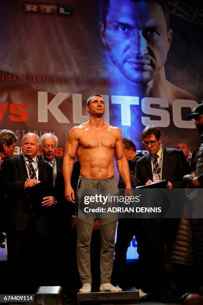Ukrainian boxer Wladimir Klitschko stands on the scales during the weigh-in event at Wembley in London on April 28, 2017 ahead of his world...