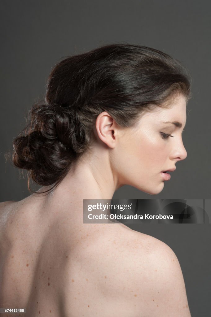 Back Shot Profile Head Shot In Profile On A Neutral Seamless Background Of A Beautiful ...