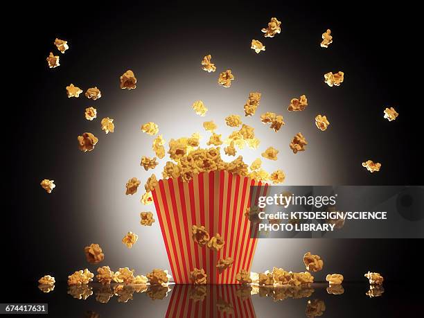 popcorn exploding from bucket - movie explosion stockfoto's en -beelden