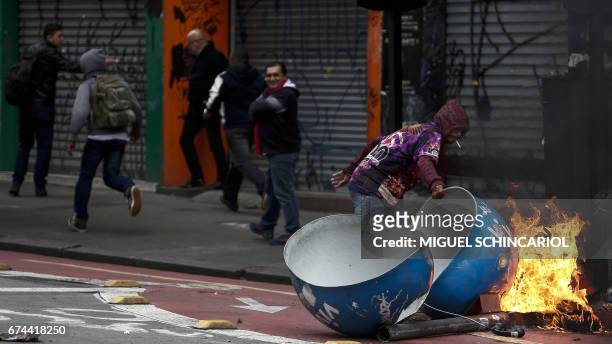 Demonstrator sets a phone boot on fire during a general strike against the Brazilian social welfare reform project in Sao Paulo, Brazil, on April 28,...