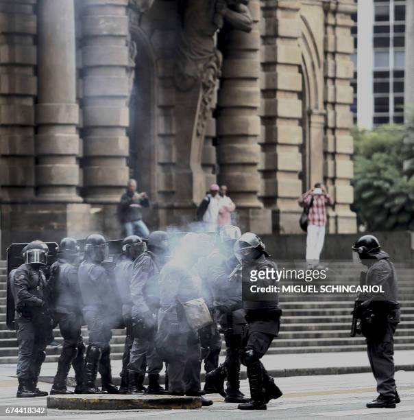 Riot police fire tear gas at demonstrators during a general strike against the Brazilian social welfare reform project in Sao Paulo, Brazil, on April...