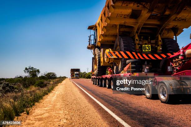 semi trucks delivering monster dump trucks in south australia - monster truck 個照片及圖片檔