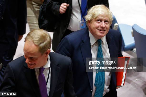 British Foreign Minister Boris Johnson and Britain's Ambassador to the United Nations Matthew Rycroft arrive to attend a security council meeting on...