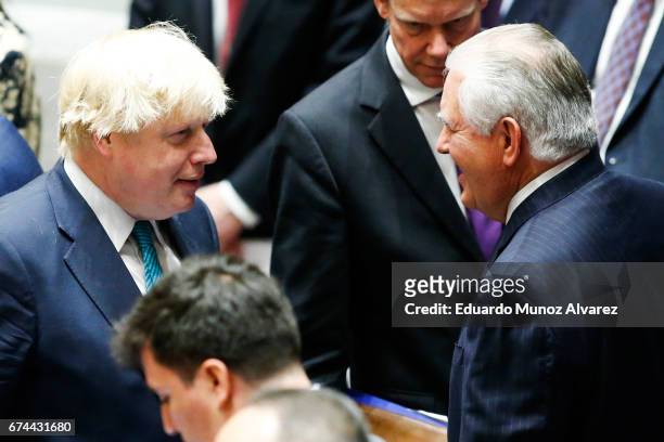 Secretary of State Rex Tillerson speaks with British Foreign Minister Boris Johnson while they attend a security council meeting on nonproliferation...