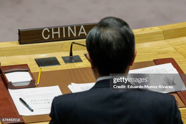 China's Foreign Minister Wang Yi speaks to members of the security council during a meeting on nonproliferation of North Korea at United Nations on...