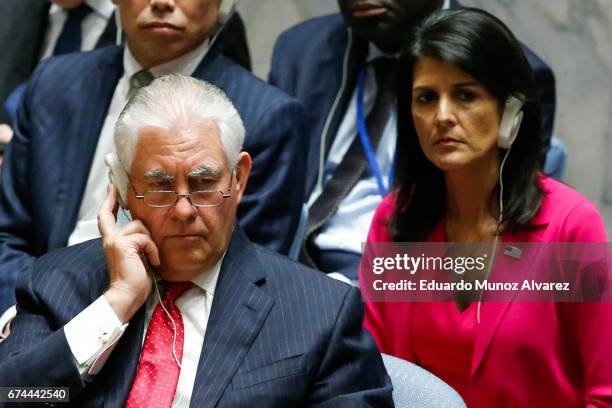 Secretary of State Rex Tillerson and US Ambassador to the UN Nikki Haley listen as China's Foreign Minister Wang Yi speaks during a security council...