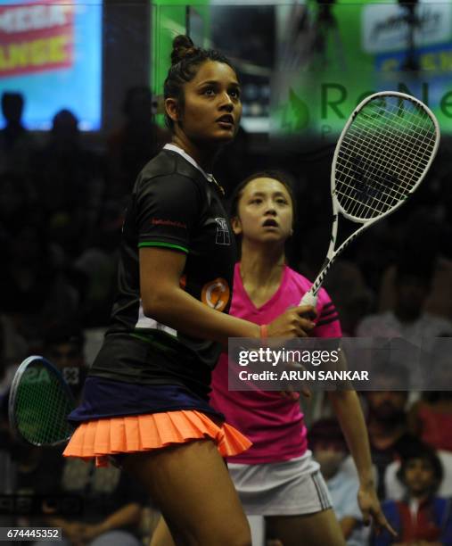 India's Dipika Pallikal prepares to play a shot as Hong Kong's Liu Tsz Ling looks on during their women's quarter-final match at 19th Asian Squash...