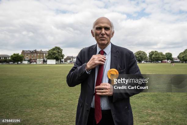 Former Liberal Democrat Secretary of State for Business, Innovation and Skills, Vince Cable, adjusts his tie during the launch of his campaign to...