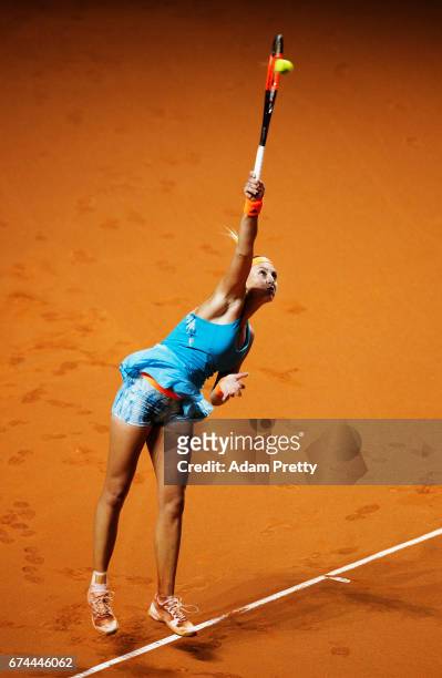 Kristina Mladenovic of France serves during her match against Carla Suarez Navarro of Spain during the Porsche Tennis Grand Prix at Porsche Arena on...