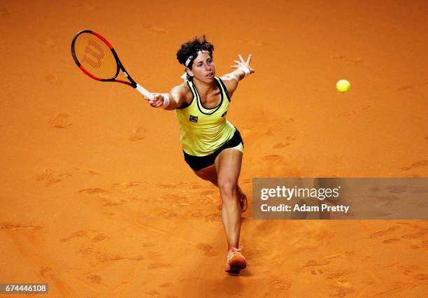 Carla Suarez Navarro of Spain plays a forehand during her match against Kristina Mladenovic of France during the Porsche Tennis Grand Prix at Porsche...